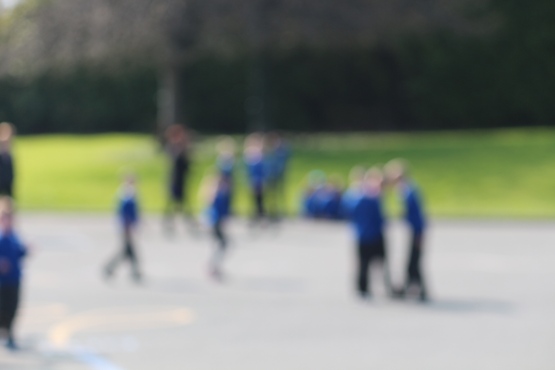 Blurred image of children in school playground